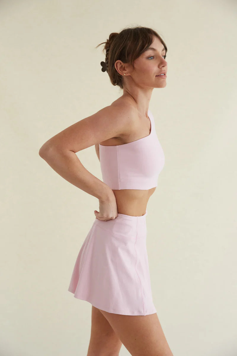 Avery Smoothing Flare Tennis Skort in Pink