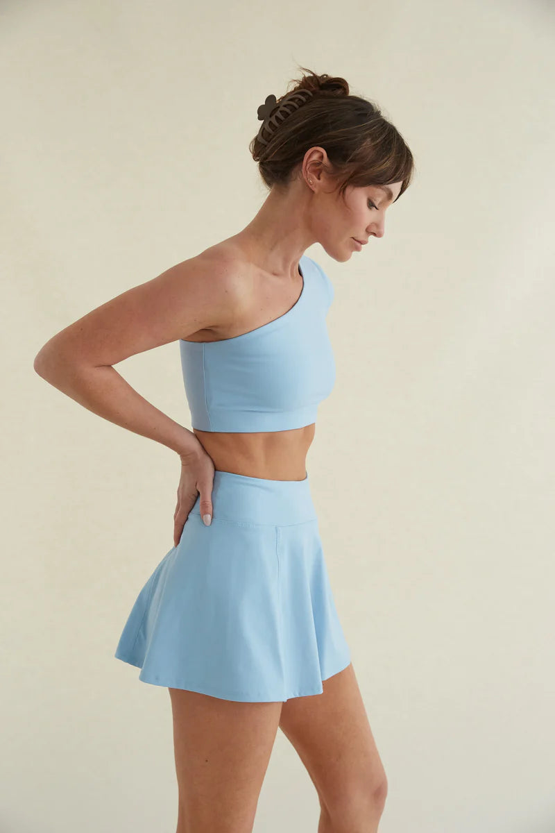 Avery Smoothing Flare Tennis Skort in Blue