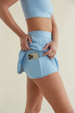 Avery Smoothing Flare Tennis Skort in Blue